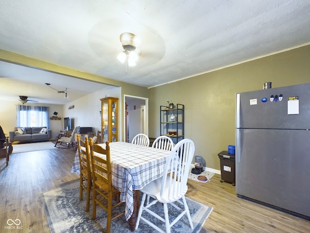 dining room featuring ceiling fan, wood-type flooring, and ornamental molding