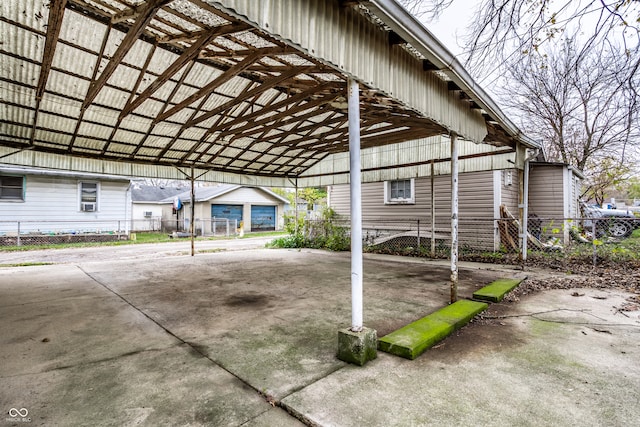 view of parking / parking lot featuring a carport