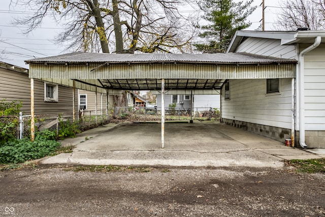 view of parking / parking lot with a carport