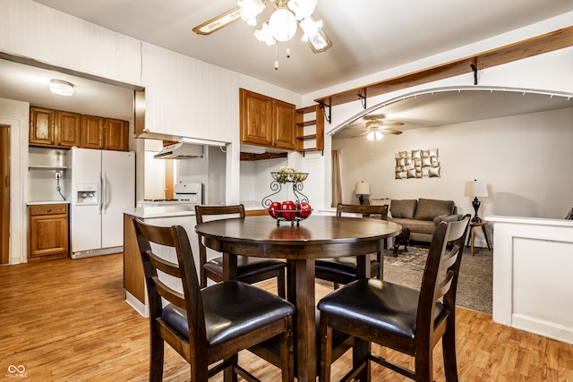 dining area with light hardwood / wood-style flooring and ceiling fan