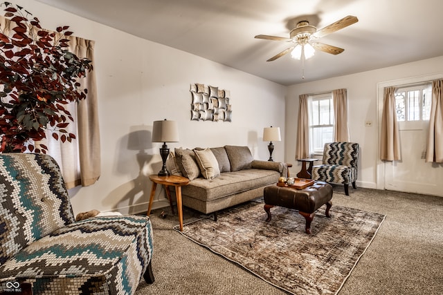 carpeted living room featuring ceiling fan