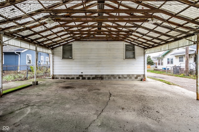 exterior space featuring concrete flooring and lofted ceiling