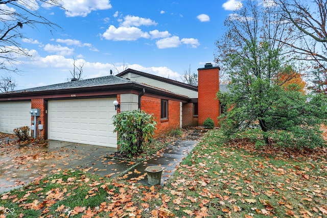 view of side of home featuring a garage