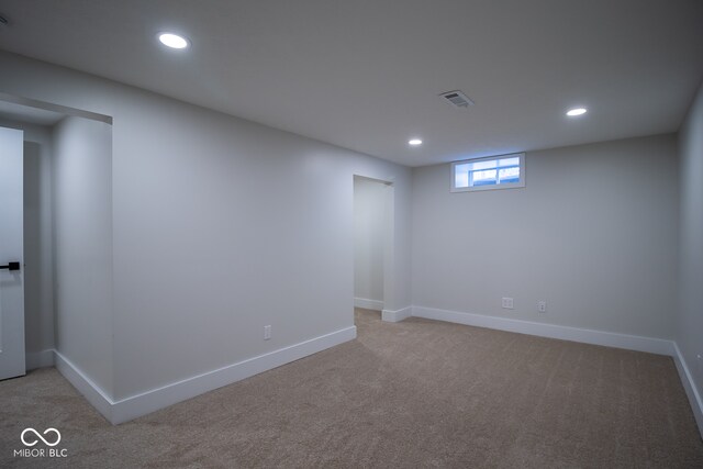 basement with light colored carpet