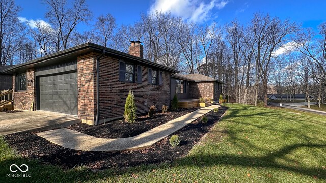 view of property exterior with a lawn and a garage