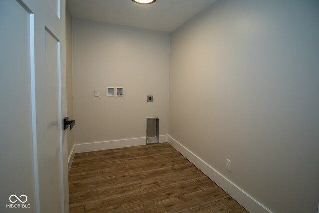 laundry area featuring hookup for a washing machine, dark hardwood / wood-style floors, and electric dryer hookup