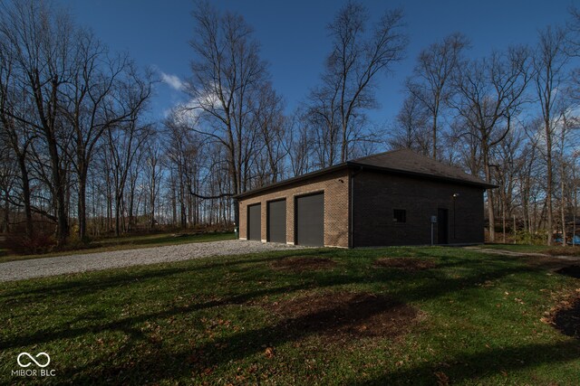 garage featuring a lawn