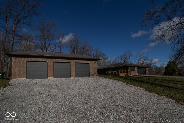 view of front facade with an outbuilding and a garage