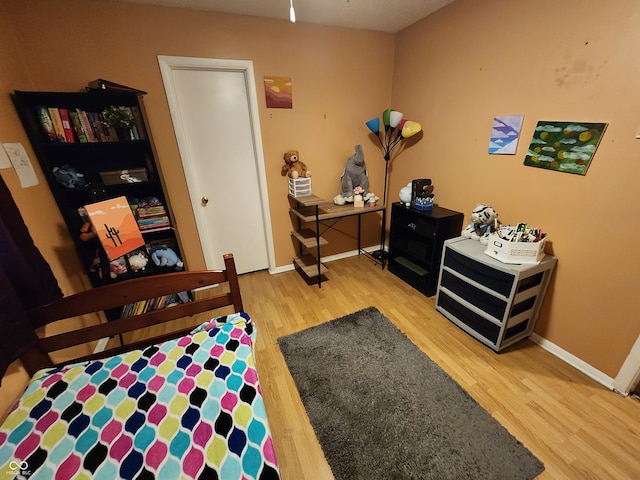 bedroom with wood-type flooring