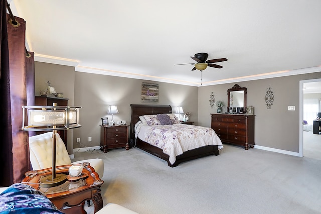 bedroom with ceiling fan, light carpet, and ornamental molding