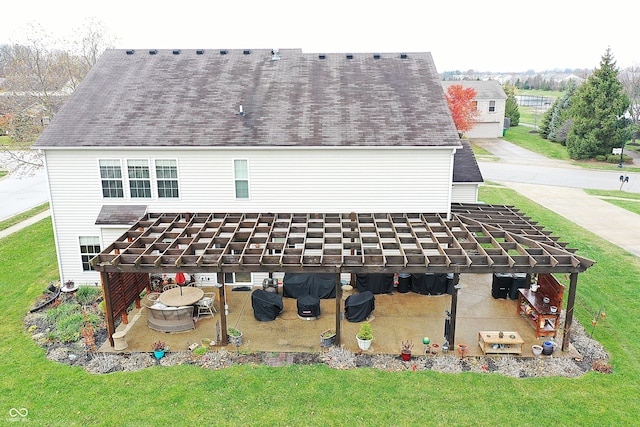 exterior space with a lawn and a patio area