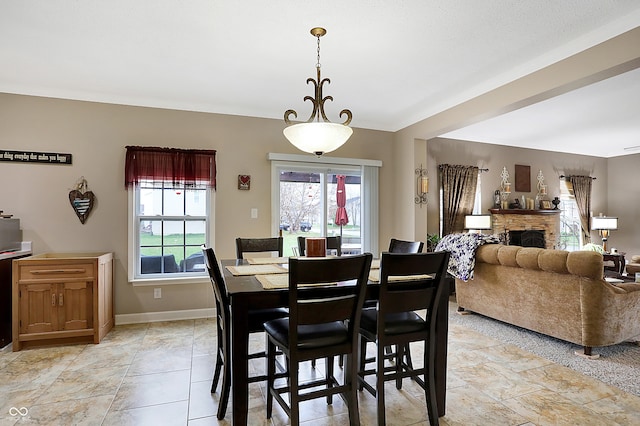 dining area featuring a fireplace