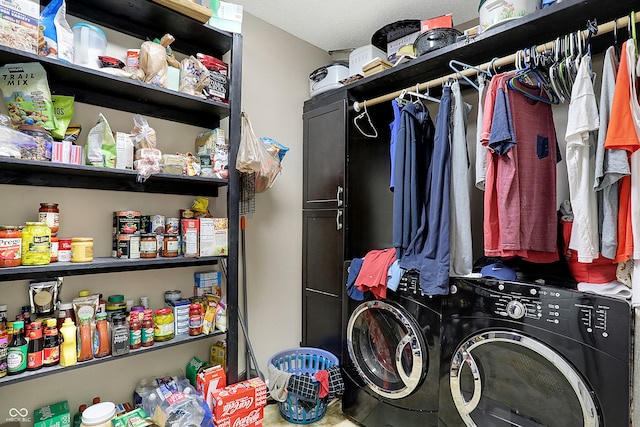 clothes washing area with separate washer and dryer