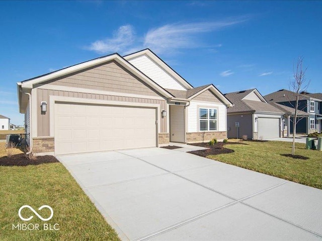 view of front facade with a front yard and a garage