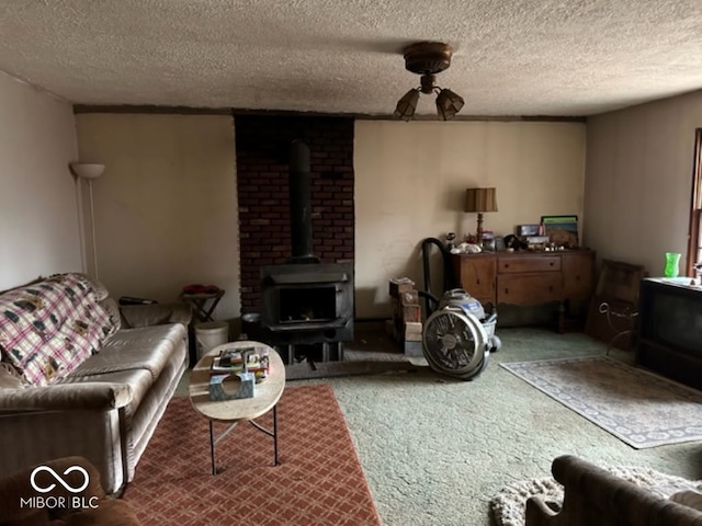 living room featuring carpet, a textured ceiling, and a wood stove