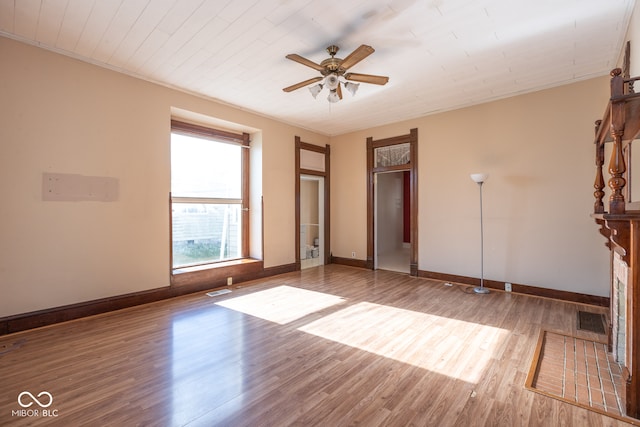 unfurnished room with hardwood / wood-style flooring, ceiling fan, and ornamental molding