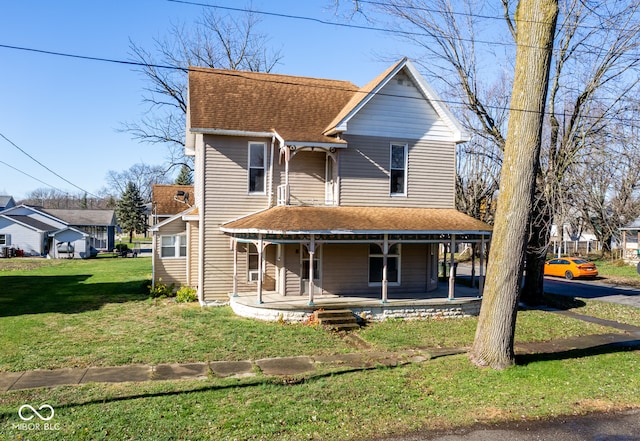 view of front of property featuring covered porch and a front lawn