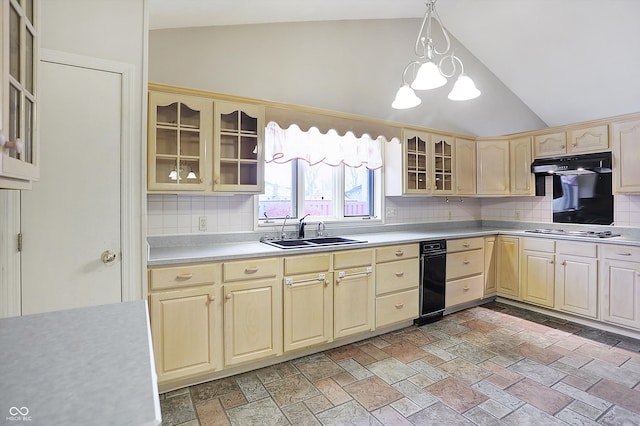 kitchen featuring decorative backsplash, pendant lighting, lofted ceiling, and sink