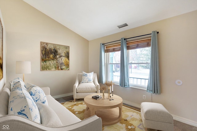 living room featuring vaulted ceiling