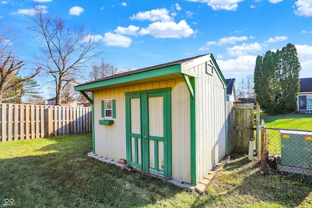 view of outdoor structure with a lawn