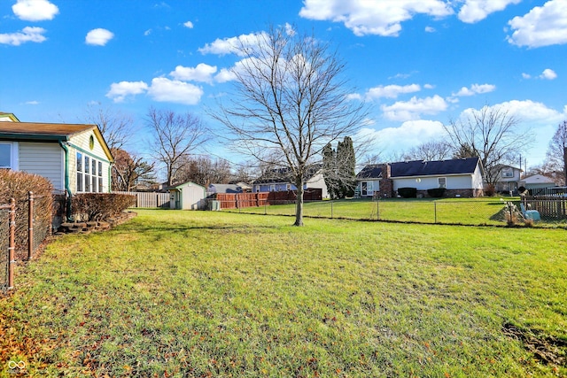 view of yard featuring a storage unit