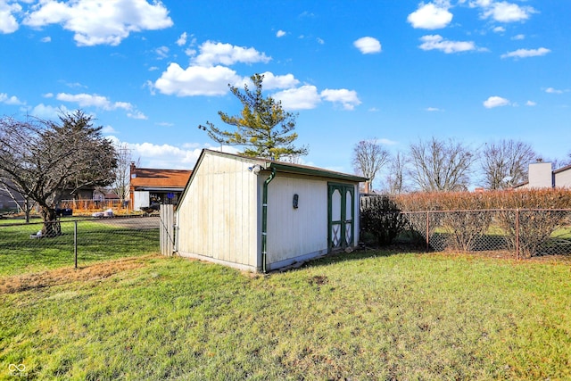 view of outdoor structure featuring a lawn