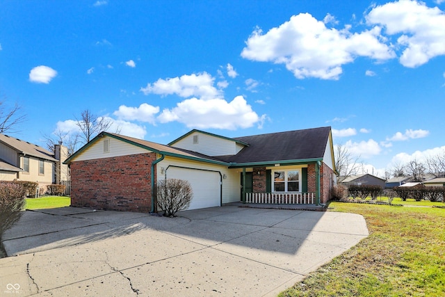 view of front facade with covered porch, a garage, and a front yard