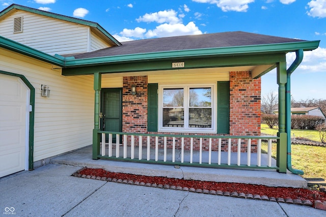 property entrance with covered porch