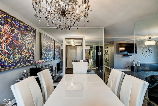 dining space with a chandelier