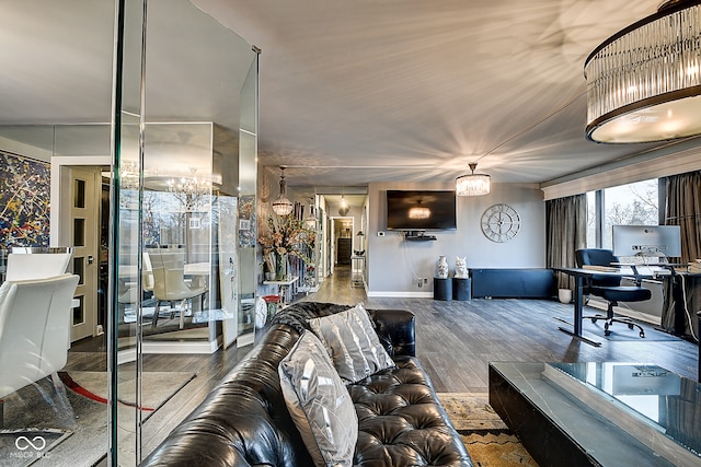 living room with a chandelier and hardwood / wood-style flooring