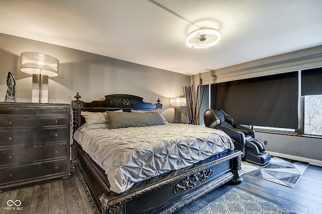 bedroom featuring dark hardwood / wood-style flooring