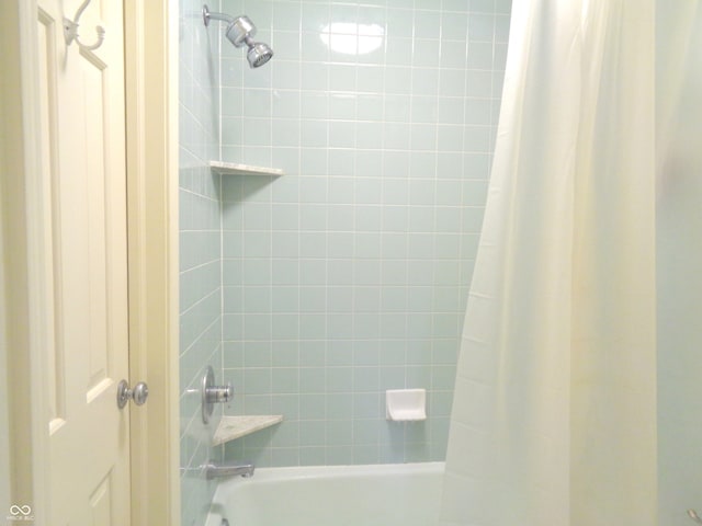 bathroom featuring shower / tub combo with curtain