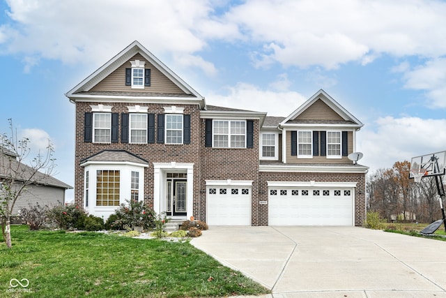 view of front of property with a front yard and a garage