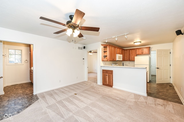 kitchen featuring brown cabinets, open shelves, light countertops, light carpet, and white appliances