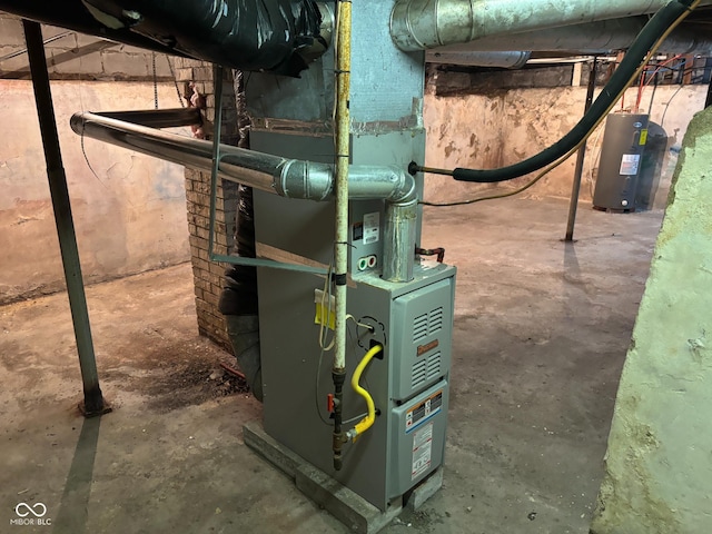 utility room featuring electric water heater and heating unit