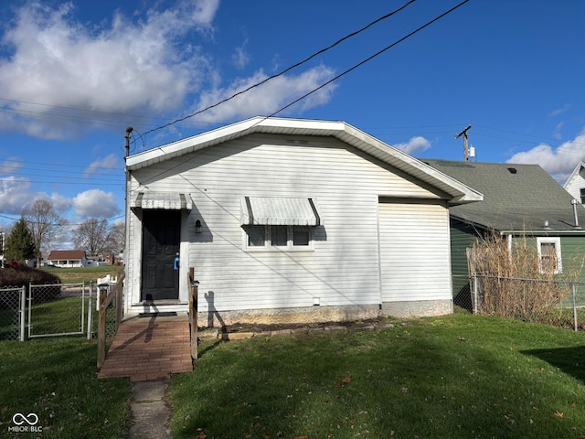 rear view of property with a yard