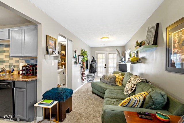 living room featuring light colored carpet and french doors