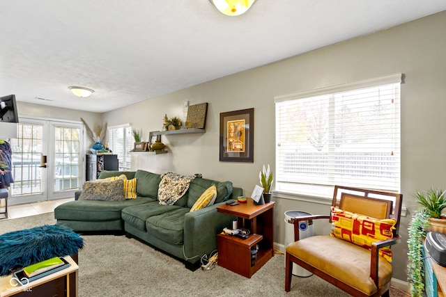 carpeted living room with french doors