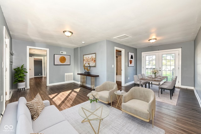 living room featuring french doors and dark wood-type flooring