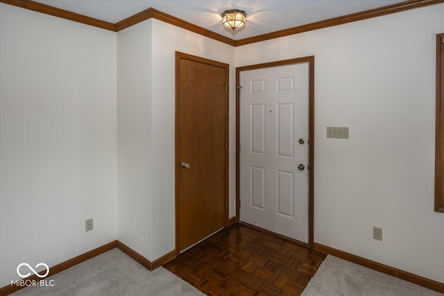 foyer featuring dark parquet floors and ornamental molding