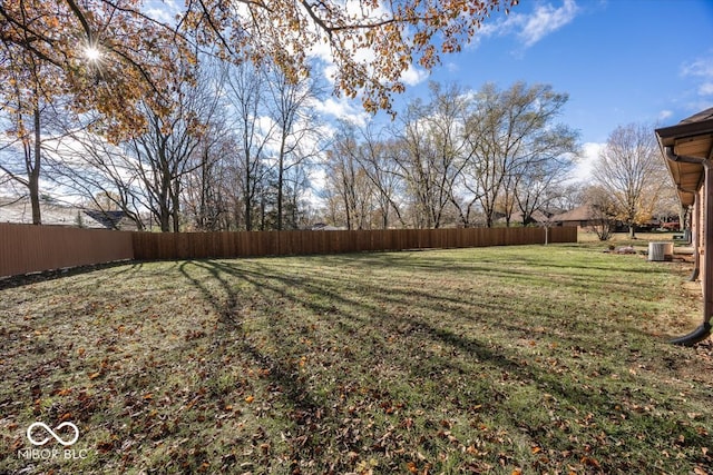 view of yard featuring central air condition unit