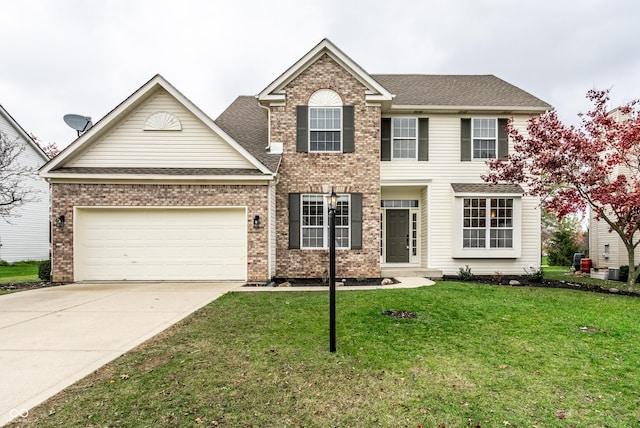 colonial inspired home featuring a front lawn