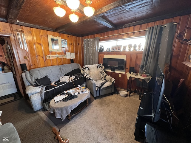 living room with wood ceiling, wooden walls, beamed ceiling, and carpet flooring