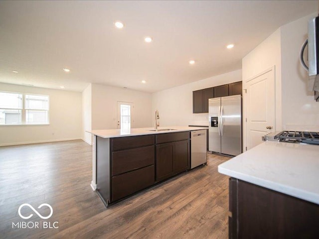 6322 Granby Dr, Whitestown, IN 46075 - kitchen featuring appliances with stainless steel finishes, dark wood-style flooring, a center island with sink, plenty of natural light, and recessed lighting