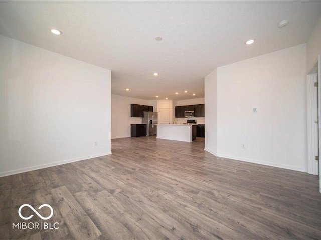 6322 Granby Dr, Whitestown, IN 46075 - unfurnished living room with dark wood-style floors and recessed lighting