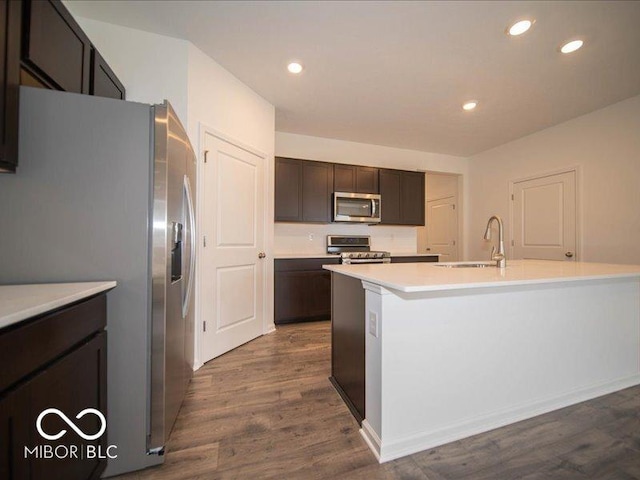 6322 Granby Dr, Whitestown, IN 46075 - kitchen with appliances with stainless steel finishes, dark wood-style floors, light countertops, dark brown cabinetry, and recessed lighting