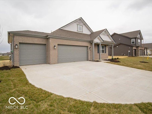 6322 Granby Dr, Whitestown, IN 46075 - view of front of property with concrete driveway, an attached garage, a front lawn, and brick siding
