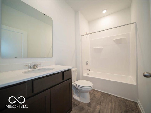 6322 Granby Dr, Whitestown, IN 46075 - full bath featuring vanity, wood finished floors, and washtub / shower combination