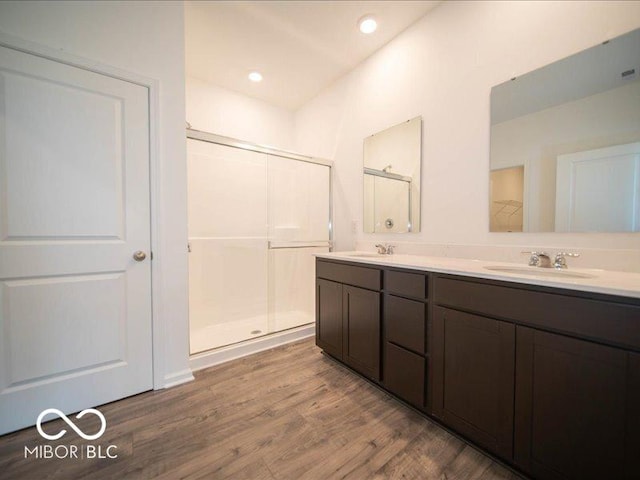 6322 Granby Dr, Whitestown, IN 46075 - full bath featuring double vanity, wood finished floors, and a shower stall