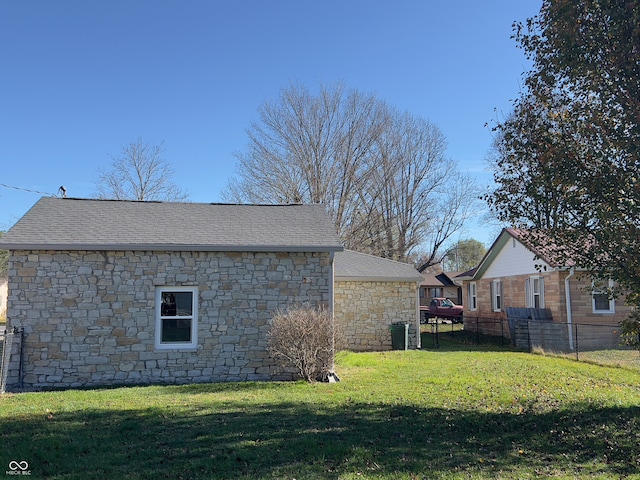 view of side of home featuring a yard